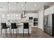 Bright kitchen with white cabinets, granite counters, and stainless steel appliances at 3045 E Bloomfield Pkwy, Gilbert, AZ 85296