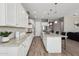 Bright kitchen with white cabinets, granite counters, and stainless steel appliances at 3045 E Bloomfield Pkwy, Gilbert, AZ 85296