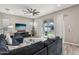 Open living area with sectional sofa, sliding doors to backyard at 3045 E Bloomfield Pkwy, Gilbert, AZ 85296