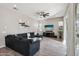 Bright living room features a sectional sofa and large TV at 3045 E Bloomfield Pkwy, Gilbert, AZ 85296