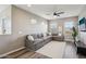 Spacious living room featuring an L-shaped sectional sofa and large windows at 3045 E Bloomfield Pkwy, Gilbert, AZ 85296