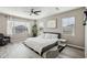 Spacious main bedroom with large bed, window, and ceiling fan at 3045 E Bloomfield Pkwy, Gilbert, AZ 85296