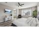 Main bedroom with large bed, ensuite bathroom, and great natural light at 3045 E Bloomfield Pkwy, Gilbert, AZ 85296