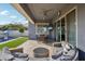 Covered patio with comfortable seating and outdoor dining area at 3045 E Bloomfield Pkwy, Gilbert, AZ 85296