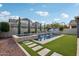 Stunning pool and spa with stonework and artificial turf at 3045 E Bloomfield Pkwy, Gilbert, AZ 85296