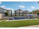 Inviting pool and spa with water features and lush landscaping at 3045 E Bloomfield Pkwy, Gilbert, AZ 85296