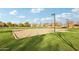 Sand volleyball court with surrounding grass at 3045 E Bloomfield Pkwy, Gilbert, AZ 85296