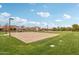 Community volleyball court with grassy areas at 3045 E Bloomfield Pkwy, Gilbert, AZ 85296
