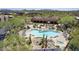 Community pool and clubhouse with mountain views at 36601 N Mule Train Rd # B19, Carefree, AZ 85377