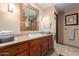 Bathroom with a vanity, sink, and shower at 36601 N Mule Train Rd # B19, Carefree, AZ 85377