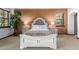 Bright bedroom featuring a comfortable bed and nightstands with lamps at 36601 N Mule Train Rd # B19, Carefree, AZ 85377