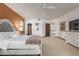 Spacious bedroom with a large bed, dresser, and plenty of natural light at 36601 N Mule Train Rd # B19, Carefree, AZ 85377