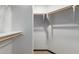 Large walk-in closet with ample hanging and shelf space at 36601 N Mule Train Rd # B19, Carefree, AZ 85377