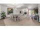 Open concept dining area with a rustic wood table and seating for six at 36601 N Mule Train Rd # B19, Carefree, AZ 85377
