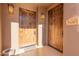 Front entry with double wood doors and a stone paved walkway at 36601 N Mule Train Rd # B19, Carefree, AZ 85377
