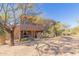 Exterior view of home with desert landscaping at 36601 N Mule Train Rd # B19, Carefree, AZ 85377