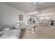 Bright living room with comfy seating and view into kitchen and dining area at 36601 N Mule Train Rd # B19, Carefree, AZ 85377