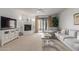Living room features a fireplace and a comfortable gray sectional sofa at 36601 N Mule Train Rd # B19, Carefree, AZ 85377
