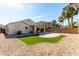 Landscaped backyard with artificial turf and patio at 4132 E Amarillo Dr, San Tan Valley, AZ 85140