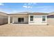 Landscaped backyard with gravel and covered patio at 4930 S 105Th Ln, Tolleson, AZ 85353