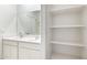 Bathroom with double vanity and built-in shelving at 4930 S 105Th Ln, Tolleson, AZ 85353