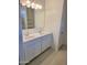 Double vanity bathroom with a mirror and light fixture at 4930 S 105Th Ln, Tolleson, AZ 85353
