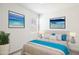 Primary bedroom with a bed, nightstands, and artwork at 4930 S 105Th Ln, Tolleson, AZ 85353