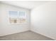 Simple bedroom with carpet, window blinds, and neutral walls at 4930 S 105Th Ln, Tolleson, AZ 85353