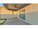 Covered patio with ceiling fan and sliding glass doors at 4930 S 105Th Ln, Tolleson, AZ 85353