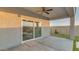 Covered patio with ceiling fan and sliding glass doors at 4930 S 105Th Ln, Tolleson, AZ 85353