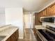 Open kitchen with granite countertops and wood cabinets at 533 W Guadalupe Rd # 2137, Mesa, AZ 85210