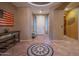 Bright entryway with tile flooring, decorative console table and bench at 5330 W Coles Rd, Laveen, AZ 85339