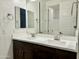 Double vanity bathroom with dark brown cabinets at 5651 E Sierra Morena St, Mesa, AZ 85215