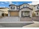 Two-story home with stone accents and a 3-car garage at 5651 E Sierra Morena St, Mesa, AZ 85215