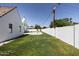 Landscaped backyard with a swimming pool and grassy area at 6140 E Calle Tuberia --, Scottsdale, AZ 85251