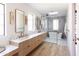 Modern bathroom with a double vanity and a glass-enclosed tub at 6140 E Calle Tuberia --, Scottsdale, AZ 85251