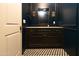 Powder room with dark vanity and geometric tile floor at 6140 E Calle Tuberia --, Scottsdale, AZ 85251