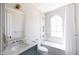 Stylish bathroom with marble accents, bathtub, and a teal vanity at 6140 E Calle Tuberia --, Scottsdale, AZ 85251