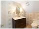 Charming bathroom with patterned wallpaper, marble vanity, and updated fixtures at 6140 E Calle Tuberia --, Scottsdale, AZ 85251