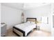 Bedroom with a queen bed and light wood floors at 6140 E Calle Tuberia --, Scottsdale, AZ 85251