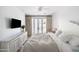 Bedroom with french doors and a rustic white dresser at 6140 E Calle Tuberia --, Scottsdale, AZ 85251