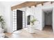 Bright and airy entryway with herringbone floors, large mirror, and unique light fixture at 6140 E Calle Tuberia --, Scottsdale, AZ 85251