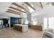 Open concept kitchen features a center island, custom cabinetry, and wood beams at 6140 E Calle Tuberia --, Scottsdale, AZ 85251