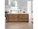 Modern kitchen showcases light oak cabinets, marble countertops, and a farmhouse sink at 6140 E Calle Tuberia --, Scottsdale, AZ 85251