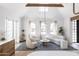 Open concept living room with vaulted ceiling, exposed beams, and comfortable seating at 6140 E Calle Tuberia --, Scottsdale, AZ 85251
