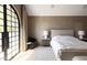 Main bedroom with arched doors and window seat, offering natural light at 6140 E Calle Tuberia --, Scottsdale, AZ 85251