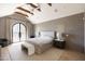 Spacious main bedroom with vaulted ceilings, exposed beams, and arched doors at 6140 E Calle Tuberia --, Scottsdale, AZ 85251