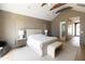 Bright main bedroom with vaulted ceilings, exposed beams and ensuite bathroom at 6140 E Calle Tuberia --, Scottsdale, AZ 85251