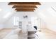 Spacious home office with wood beams, built-in shelving and large windows at 6140 E Calle Tuberia --, Scottsdale, AZ 85251