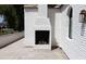 Outdoor fireplace built into the white brick exterior wall of the house at 6140 E Calle Tuberia --, Scottsdale, AZ 85251